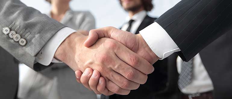 Welcome and handshake business people