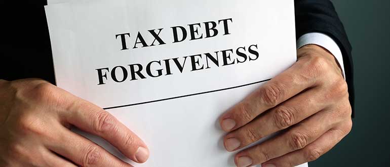 Man holdsTax debt forgiveness agreement